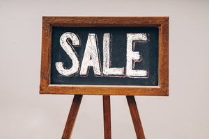 sale on unisex watches at victor de rossa written on a chalkboard in white letters